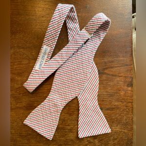 Red, white, blue striped bow tie. Mercy streams.